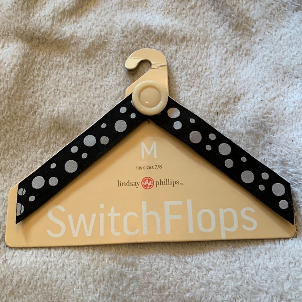 BRAND NEW pair of interchangeable strap SwitchFlops. “Leslie” pattern. Medium.